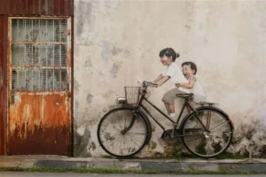 رحلة لا تنسى تبدأ من هنا : أفضل معالم السياحة في ماليزيا 9 شارع أرمينيا لوحة Children on a Bicycle من أفضل أماكن السياحة في ماليزيا