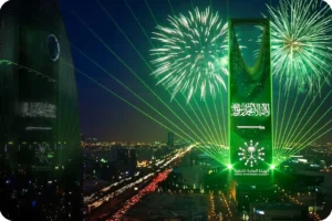 Green illuminated landmark during Saudi National Day celebrations