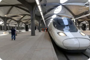 Haramain train beside a passenger platform before departure