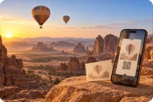 Ticket display overlooking hot air balloons and sandstone formations at sunrise