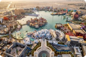 Panoramic view of themed buildings and waterfront attractions at Boulevard World Riyadh.