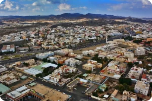 Elevated view of closely packed buildings and streets in Taif